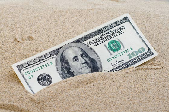 Money in the sand